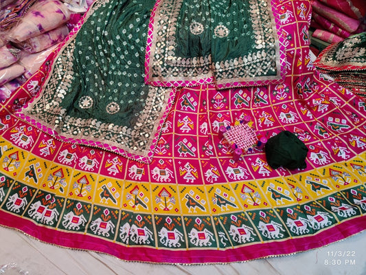 Patola Print Lehenga Choli Dupatta Set in Dola Silk with Gota Patti Work