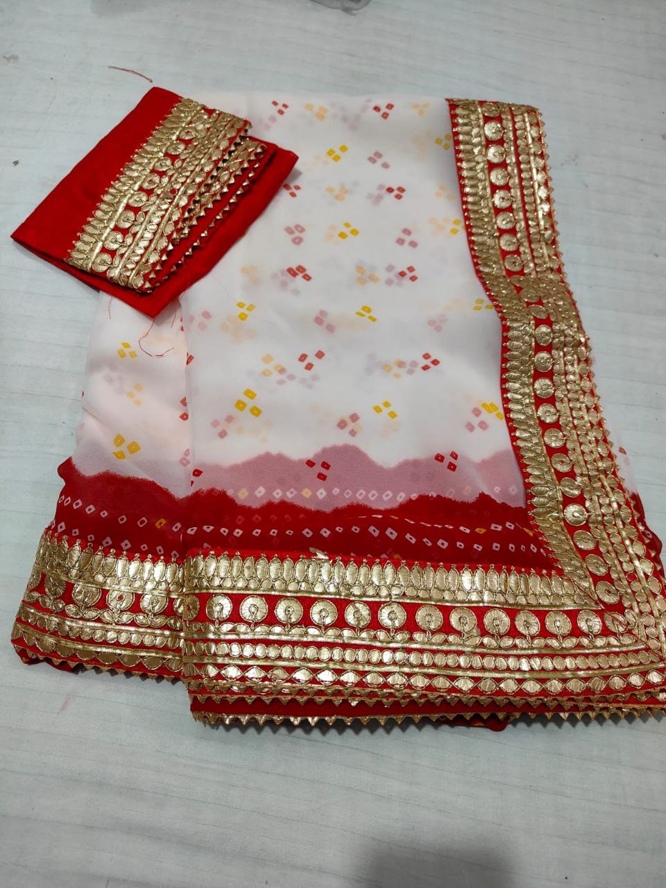 White and Red Bandhani Print Georgette Saree with Gota Work Border & Blouse