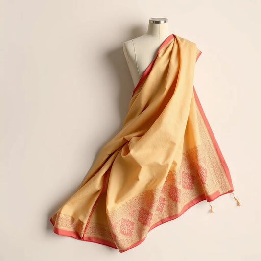 Draped georgette bandhej saree with visible motifs, soft folds, and neatly styled pallu on a neutral background