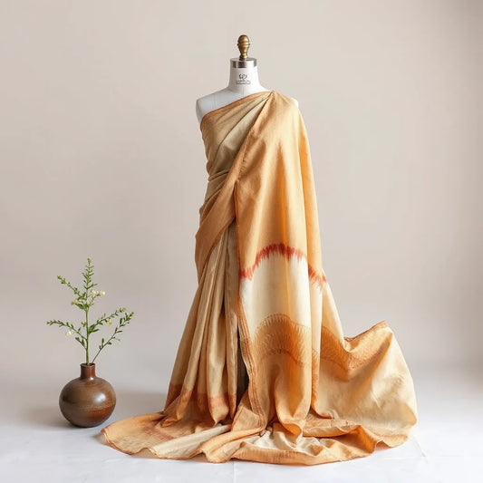 Georgette bandhej sari draped on a mannequin with visible tie-dye pattern and flowing pallu folds.