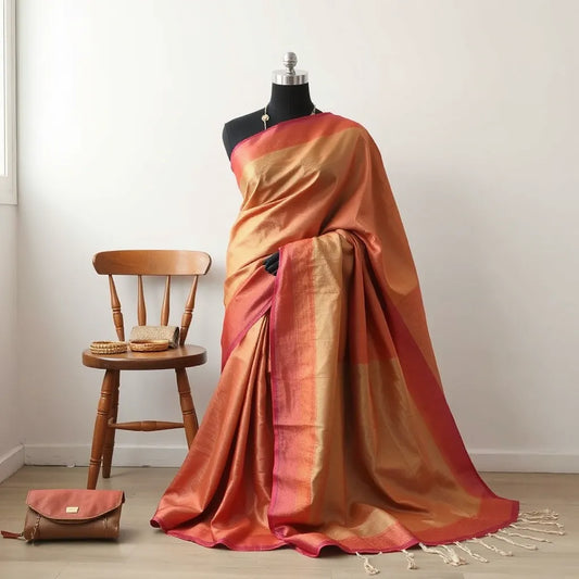 Draped ready-to-wear saree on a mannequin with neatly placed pallu and accessories in soft natural light