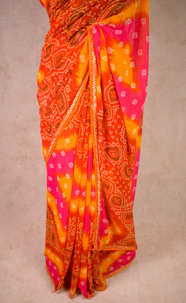 Georgette bandhani saree in pink orange - KANHASAREE