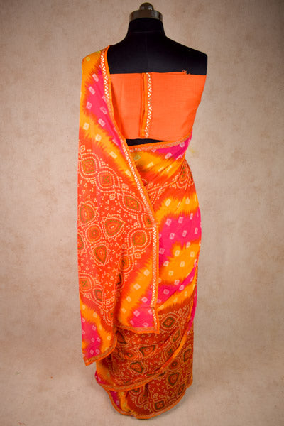 Georgette bandhani saree in pink orange - KANHASAREE