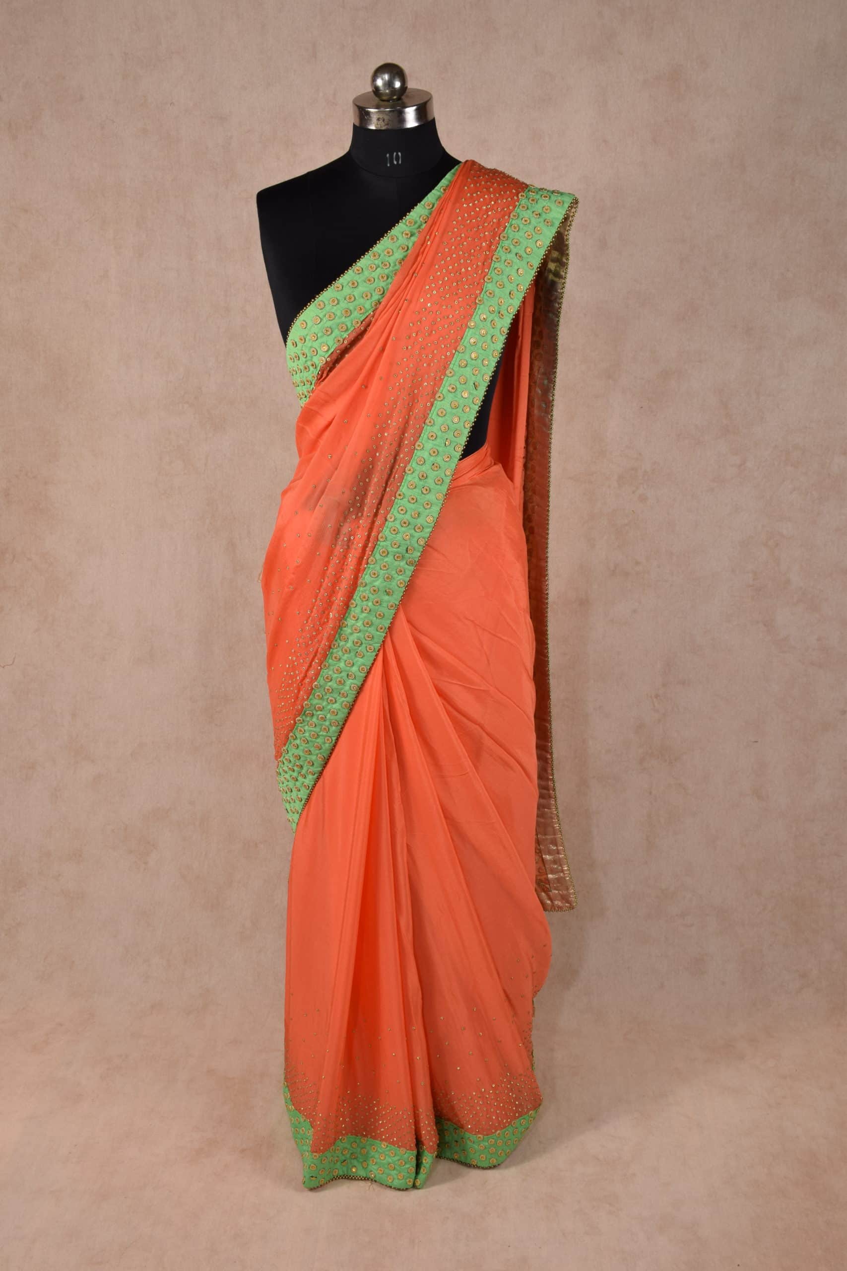 Elegant Peach Color saree embellished with stone work and raw silk border - KANHASAREE