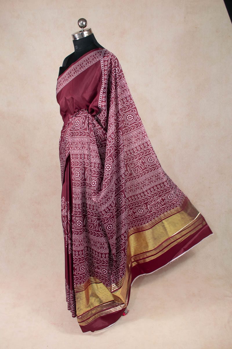 Dazzling Dola Silk Bandhani Saree with Golden Patta - KANHASAREE