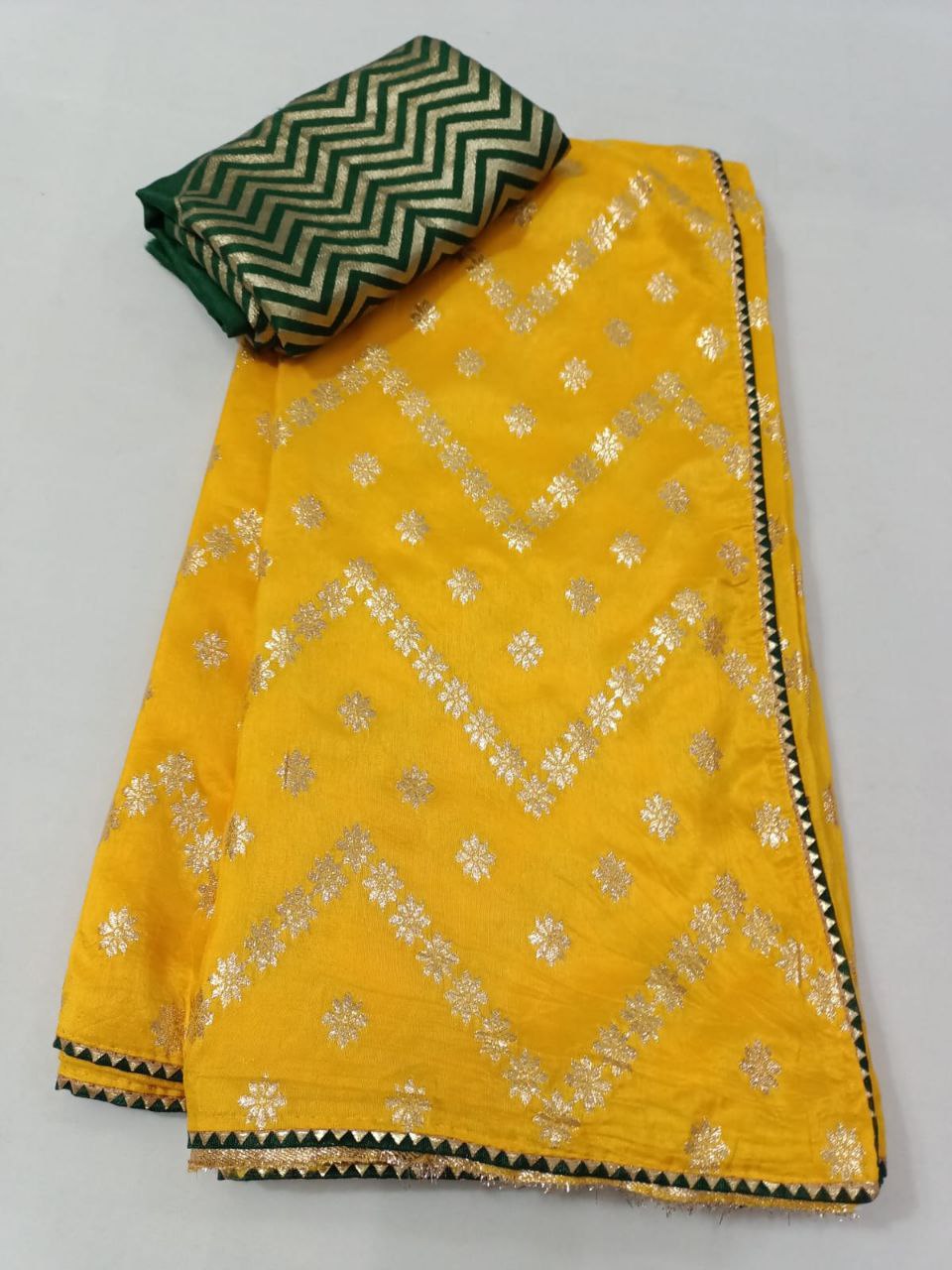 Yellow Dola Silk Saree with Zigzag Zari Weaving & Green Bijiya Border | Contrast Green Blouse