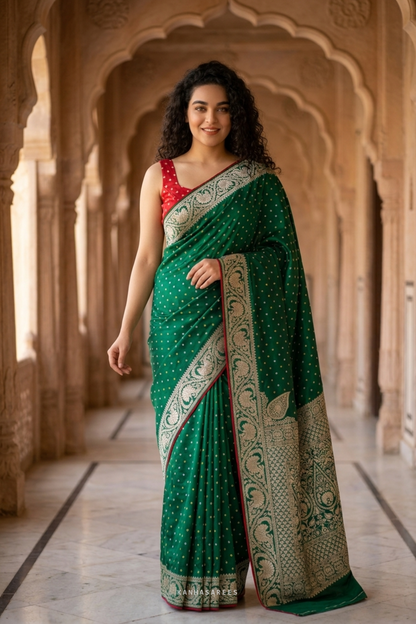 Green Dola silk saree with rich golden zari embellishments.