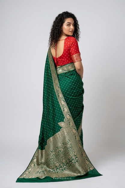 Green Dola silk saree, artfully draped to highlight its golden zari.